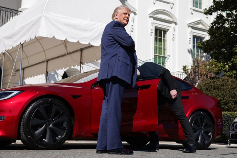 US President Trump views Tesla vehilces in front of the White House